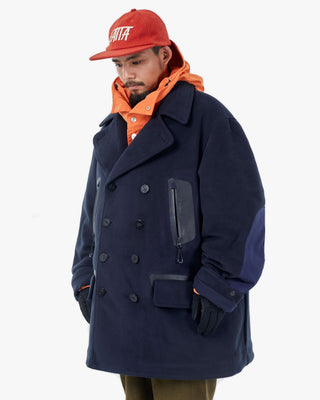 Men's Gloverall x Norbit Reversible Dufflewool Peacoat in Dark Navy, fleece side, worn three-quarter view, by Gloverall