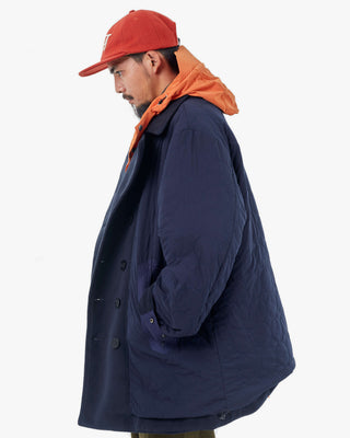 Men's Gloverall x Norbit Reversible Dufflewool Peacoat in Dark Navy, onion quilted side, worn side view, by Gloverall